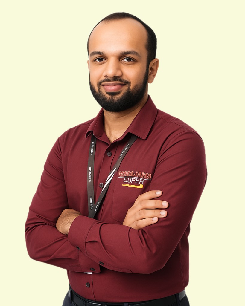 Mr. Ashar, retail supervisor, in a Mahajana Super maroon shirt